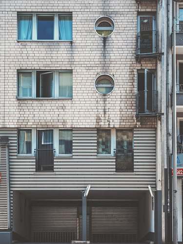 window architectural photography of gray house shutter